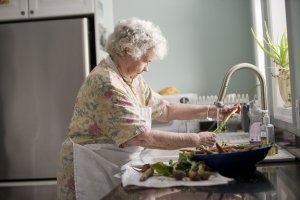 -elderly-woman-washing-produce-pv